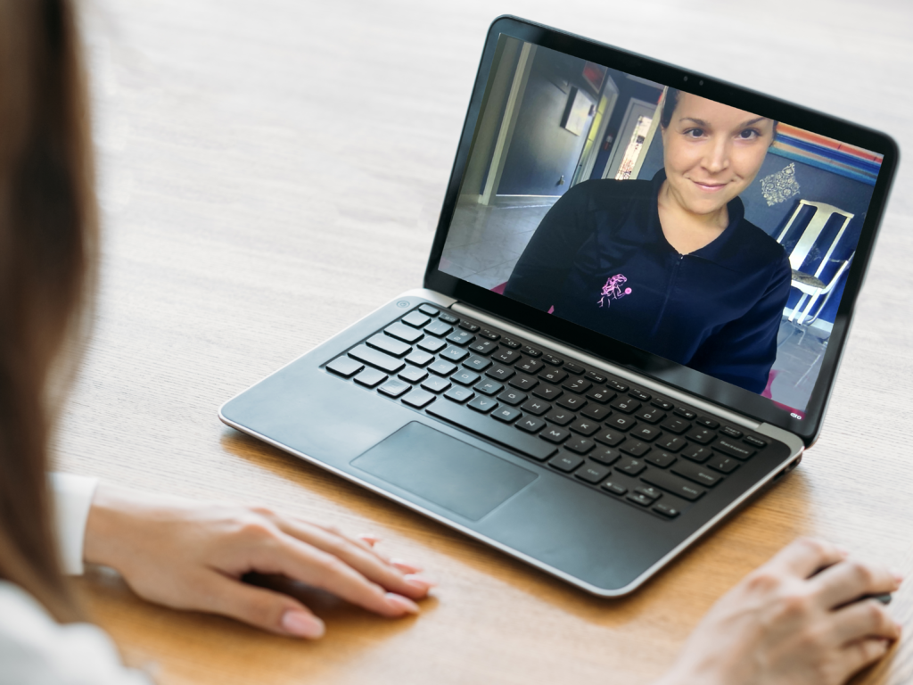 A client in an online coaching session with Gwen on her laptop – FIT by GP